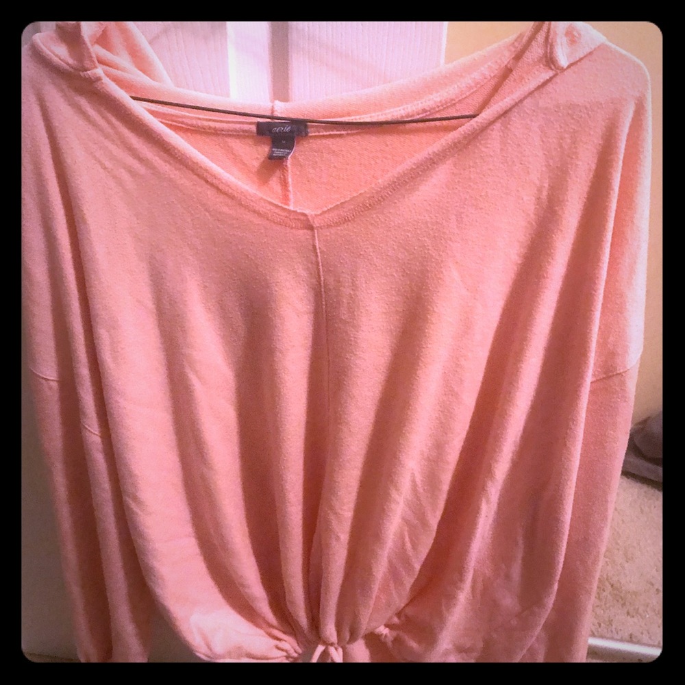Loose fitting peach colored sweater